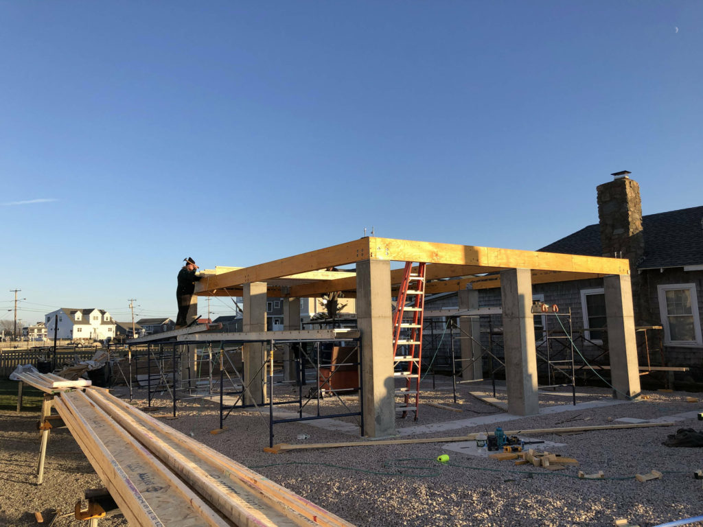 Completed reinforced concrete foundation with LVL structural support framing being installed by NJ&J Builders’ carpentry team.