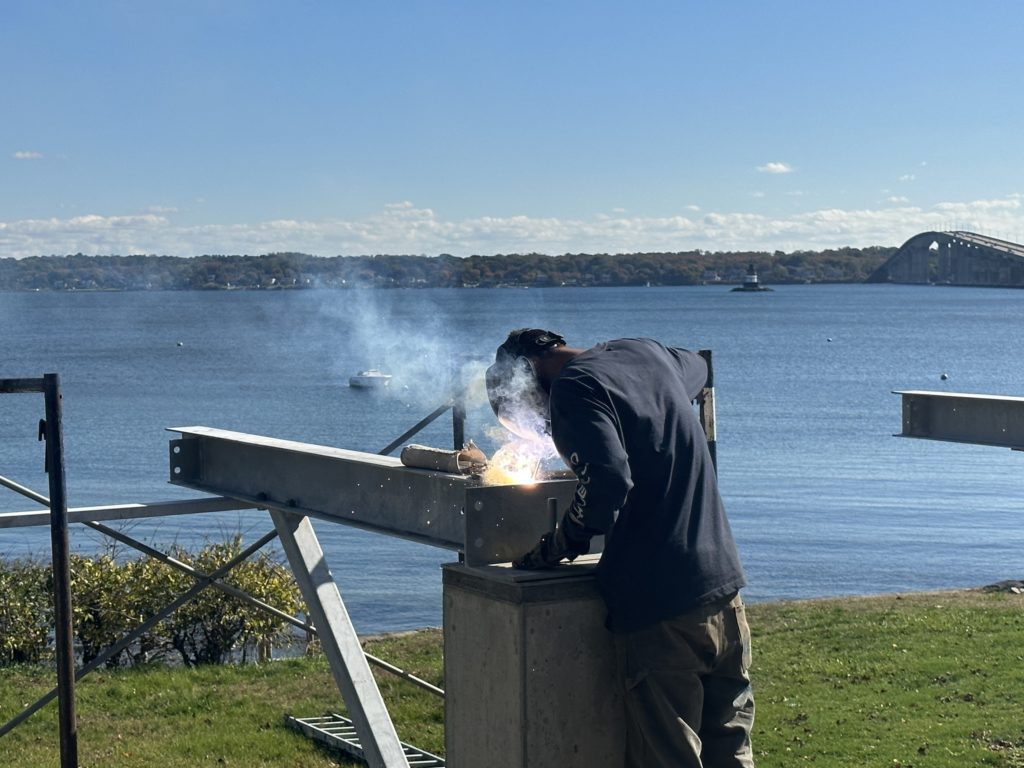 On-site structural steel welding for cantilevered deck support | Custom coastal engineering RI