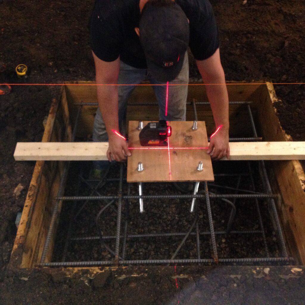 Design build:Precision laser layout for reinforced concrete footings | High-performance coastal construction RI